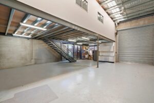 Airport West warehouse for sale with roller shutter and internal stairwell in commercial zone