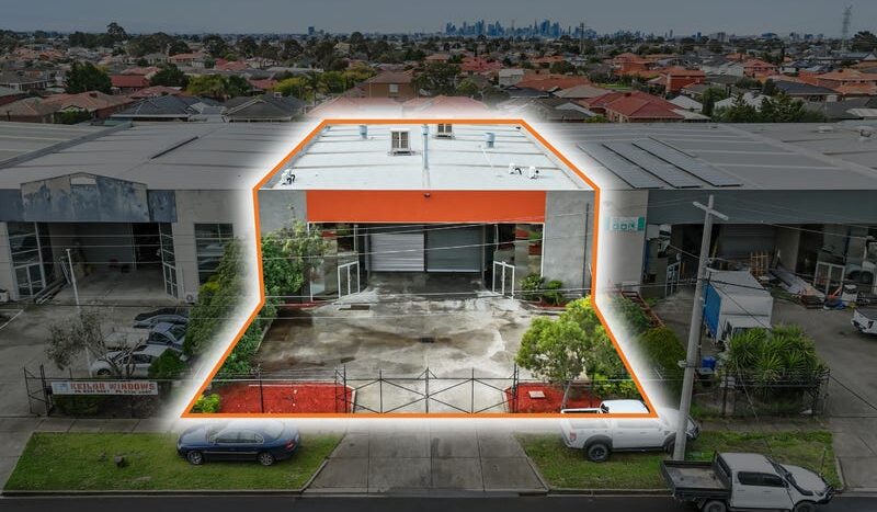 Aerial view of 20 Webber Parade, Keilor East with site boundary outlined and Melbourne CBD skyline in distance