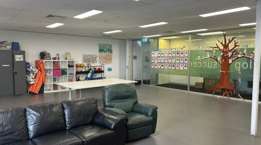 Interior of healthcare property with open-plan seating and educational wall display at Craigieburn Junction